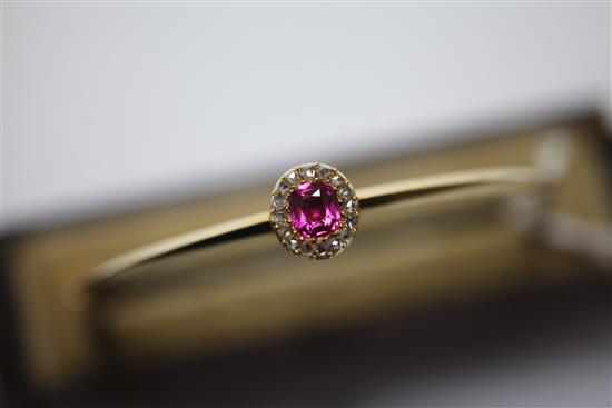 A Victorian gold, ruby and diamond cluster hinged bangle,